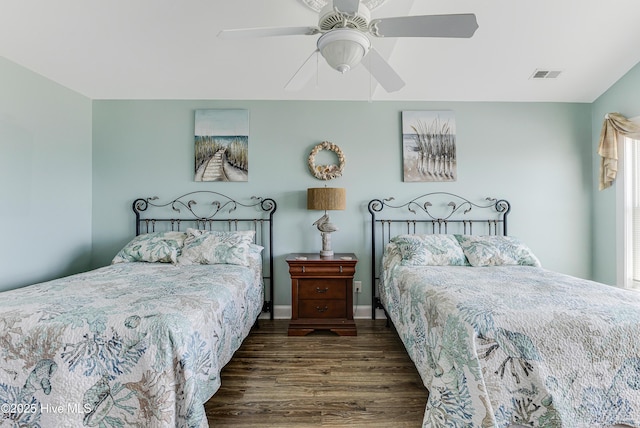 1726 W Beach Dr, Oak Island, NC 28465 - bedroom featuring wood finished floors and ceiling fan
