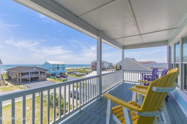 1726 W Beach Dr, Oak Island, NC 28465 - wooden deck with a water view