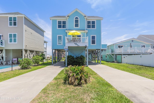 1726 W Beach Dr, Oak Island, NC 28465 - beach home with a carport and driveway