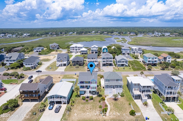 1726 W Beach Dr, Oak Island, NC 28465 - aerial view of residential area with a large body of water