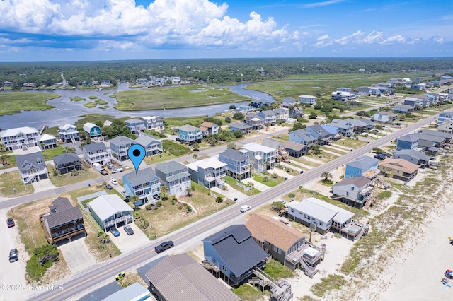 1726 W Beach Dr, Oak Island, NC 28465 - aerial perspective of suburban area featuring a large body of water