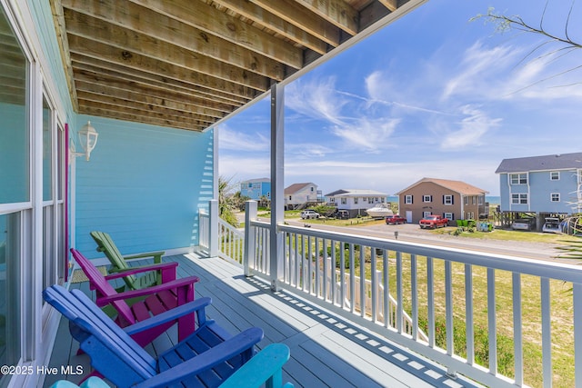 1726 W Beach Dr, Oak Island, NC 28465 - porch with a residential view