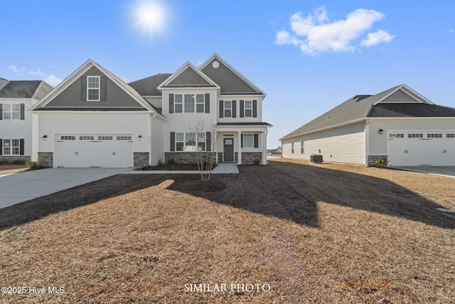 118 Sloth Ln, Jacksonville, NC 28546 - view of front facade with stone siding and driveway