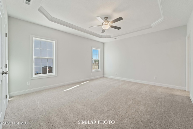 118 Sloth Ln, Jacksonville, NC 28546 - unfurnished room with a tray ceiling, a ceiling fan, and light carpet
