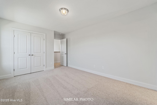 118 Sloth Ln, Jacksonville, NC 28546 - unfurnished bedroom featuring carpet flooring and a closet