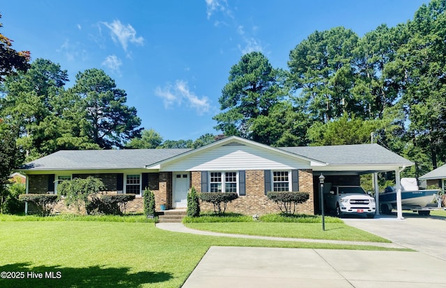 1721 Nash St NW, Wilson, NC 27893 - single story home with brick siding, a front lawn, a carport, and driveway
