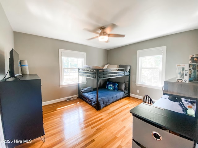 1721 Nash St NW, Wilson, NC 27893 - bedroom featuring wood finished floors and ceiling fan