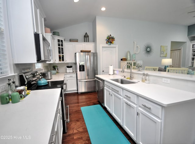 4875 Frasier Cir, Shallotte, NC 28470 - kitchen with appliances with stainless steel finishes, recessed lighting, white cabinetry, dark wood-style flooring, and light countertops