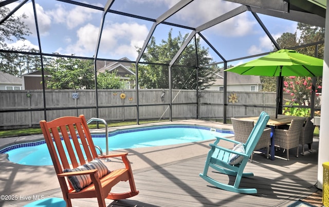 4875 Frasier Cir, Shallotte, NC 28470 - view of swimming pool featuring a fenced backyard, a deck, and glass enclosure