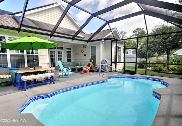4875 Frasier Cir, Shallotte, NC 28470 - view of swimming pool with a patio area, outdoor lounge area, a ceiling fan, glass enclosure, and french doors
