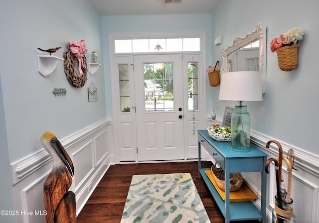 4875 Frasier Cir, Shallotte, NC 28470 - entryway featuring wainscoting, dark wood-type flooring, and a decorative wall