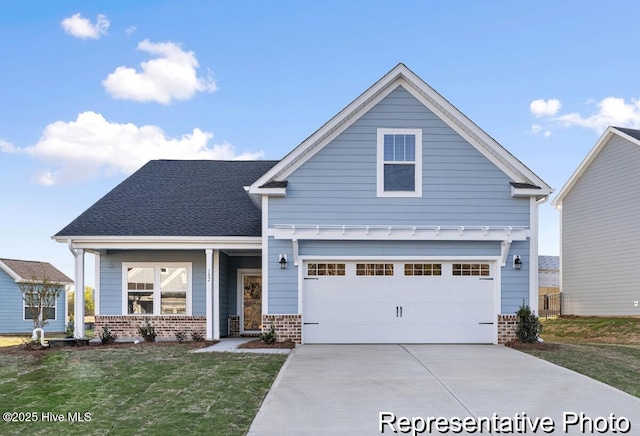 1664 Greenside Ct SW Unit 77, Ocean Isle Beach, NC 28469 - view of front of house with brick siding, driveway, a front yard, and a garage
