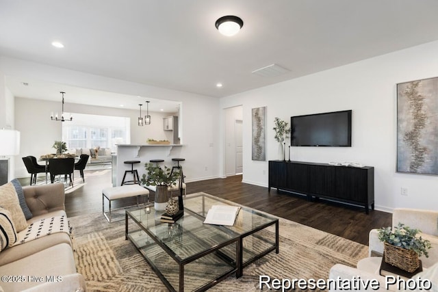 1664 Greenside Ct SW Unit 77, Ocean Isle Beach, NC 28469 - living area featuring wood finished floors, a chandelier, and recessed lighting