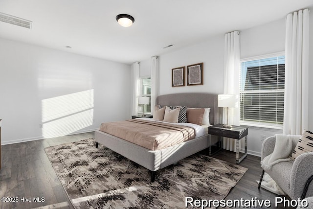 1664 Greenside Ct SW Unit 77, Ocean Isle Beach, NC 28469 - bedroom featuring wood finished floors and baseboards