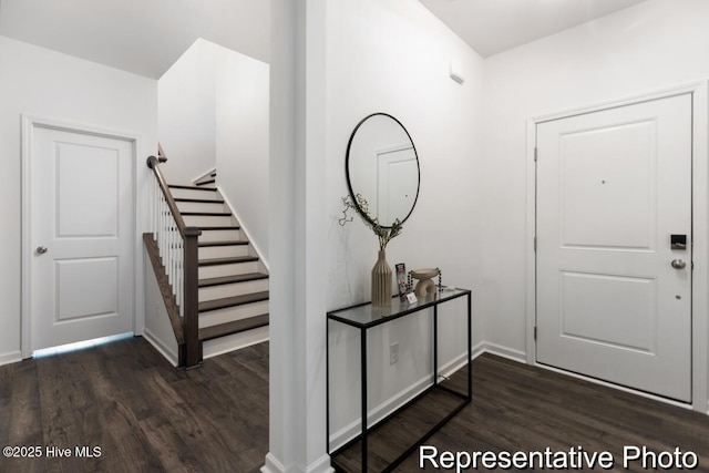 1664 Greenside Ct SW Unit 77, Ocean Isle Beach, NC 28469 - foyer entrance featuring wood finished floors and stairs