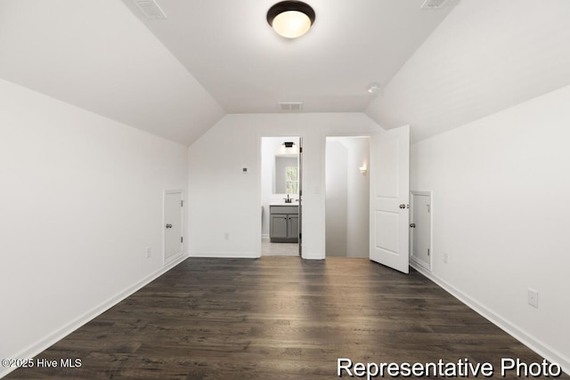 1664 Greenside Ct SW Unit 77, Ocean Isle Beach, NC 28469 - additional living space with dark wood finished floors and lofted ceiling
