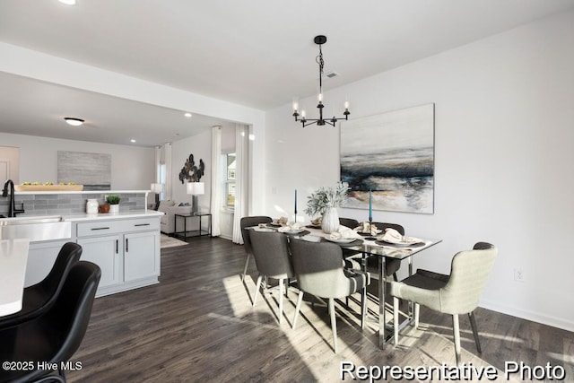 1664 Greenside Ct SW Unit 77, Ocean Isle Beach, NC 28469 - dining room featuring a chandelier, dark wood-style floors, and recessed lighting