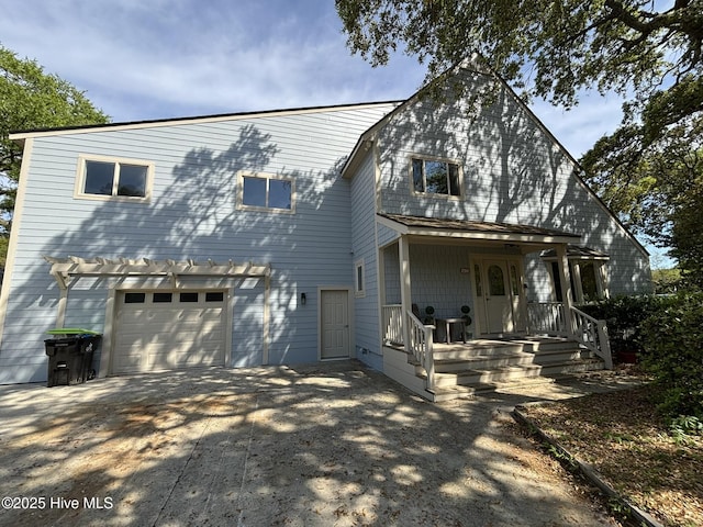 31 Augusta Dr, Oak Island, NC 28465 - view of front facade with concrete driveway and a garage