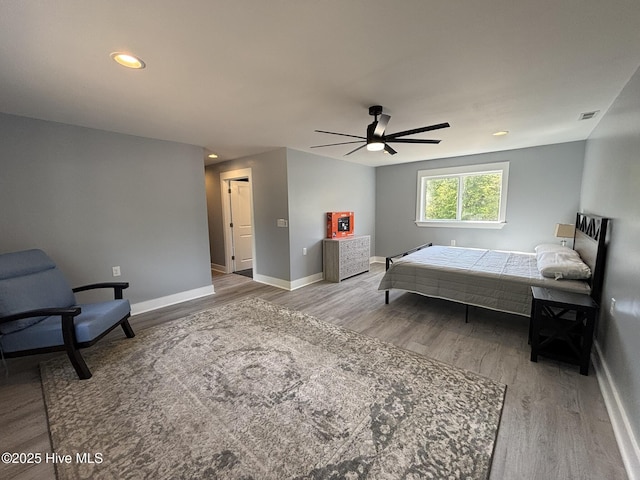 31 Augusta Dr, Oak Island, NC 28465 - bedroom with wood finished floors, recessed lighting, and a ceiling fan