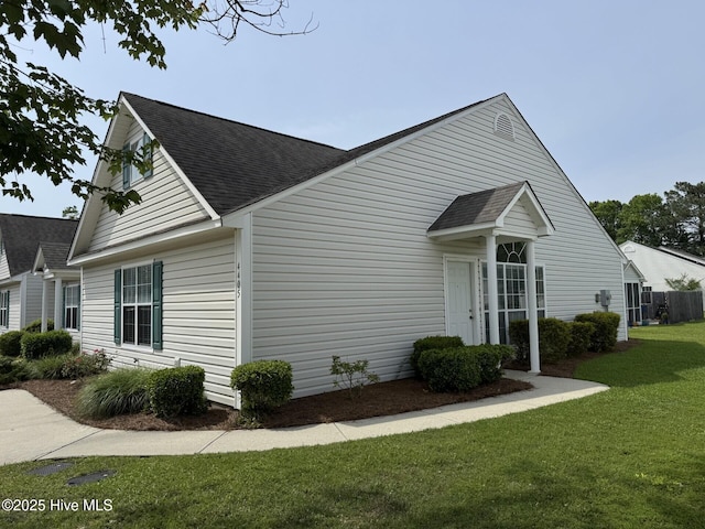 4405 Jasmine Cove Way, Wilmington, NC 28412 - view of side of home with a shingled roof and a yard