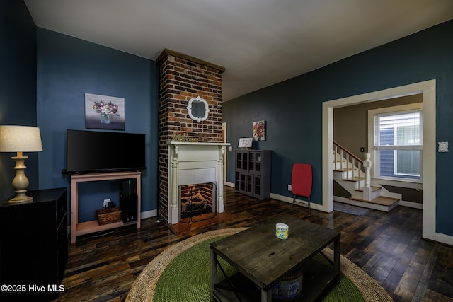 507 Blades Ave, New Bern, NC 28560 - living room featuring a fireplace, wood-type flooring, and stairway