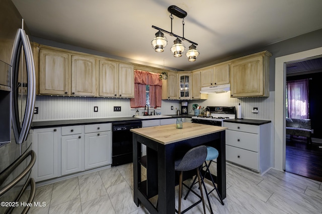 507 Blades Ave, New Bern, NC 28560 - kitchen featuring stainless steel fridge, black dishwasher, white range with gas cooktop, under cabinet range hood, and glass insert cabinets