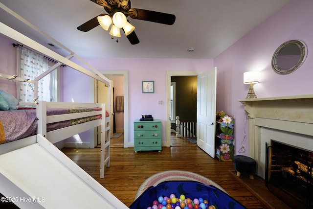 507 Blades Ave, New Bern, NC 28560 - bedroom featuring wood finished floors, a fireplace, and ceiling fan