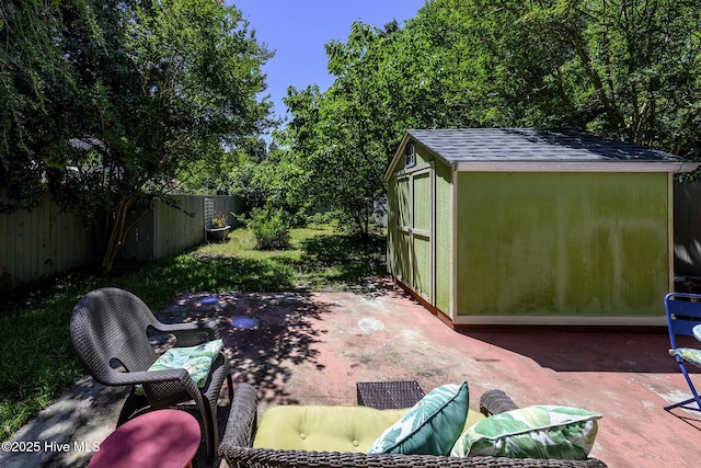 507 Blades Ave, New Bern, NC 28560 - fenced backyard with a patio and a storage unit