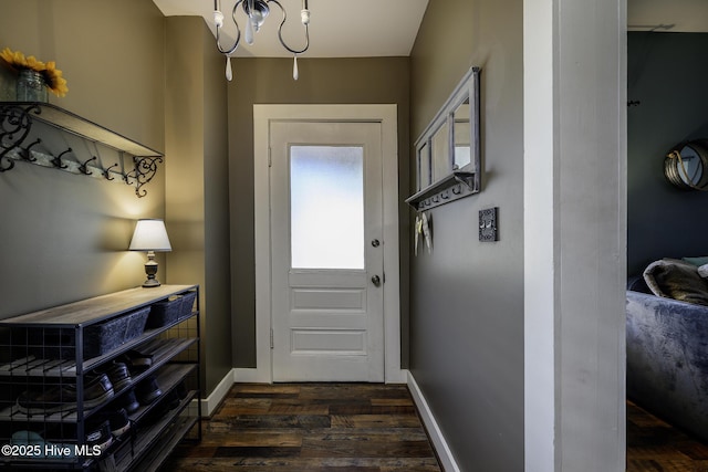 507 Blades Ave, New Bern, NC 28560 - entryway with dark wood-style floors and a chandelier