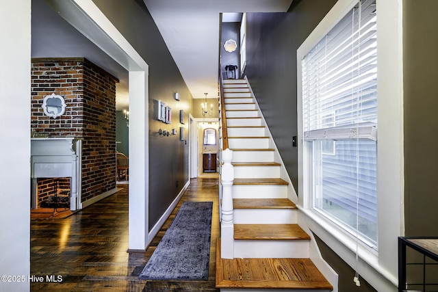 507 Blades Ave, New Bern, NC 28560 - stairs featuring wood finished floors and a brick fireplace