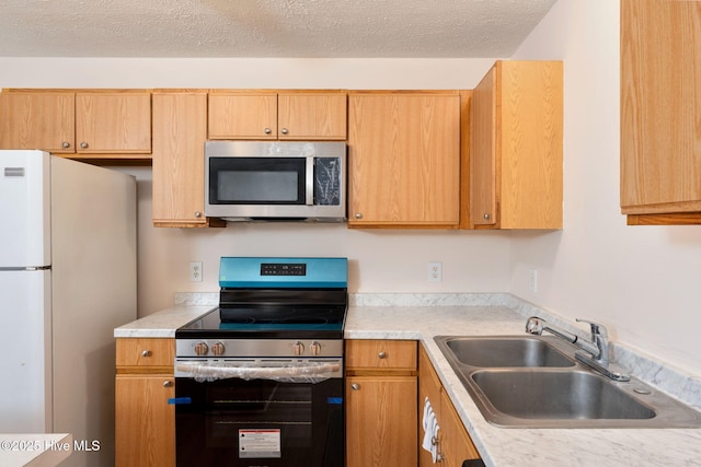 1901 Hess St, Wilmington, NC 28411 - kitchen with appliances with stainless steel finishes, light countertops, and a textured ceiling