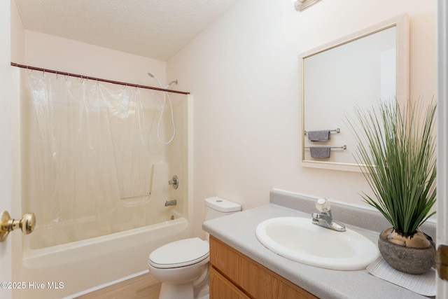 1901 Hess St, Wilmington, NC 28411 - bathroom with vanity, shower / bath combo with shower curtain, a textured ceiling, and wood finished floors