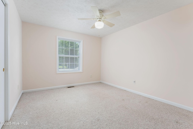 1901 Hess St, Wilmington, NC 28411 - carpeted empty room with a textured ceiling and ceiling fan