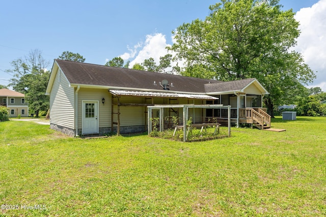 1901 Hess St, Wilmington, NC 28411 - rear view of house featuring a lawn and a shingled roof