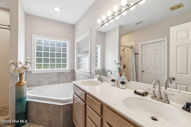 820 Jackeys Creek Ln SE, Leland, NC 28451 - bathroom with a garden tub, a tile shower, and double vanity