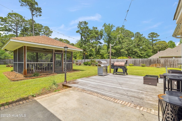 820 Jackeys Creek Ln SE, Leland, NC 28451 - fenced backyard with a sunroom, area for grilling, and a wooden deck
