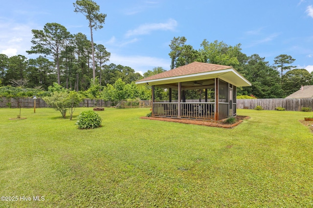 820 Jackeys Creek Ln SE, Leland, NC 28451 - fenced backyard featuring a sunroom and a ceiling fan