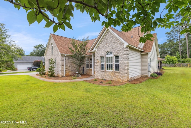 820 Jackeys Creek Ln SE, Leland, NC 28451 - view of front of home with a shingled roof, brick siding, and a front lawn