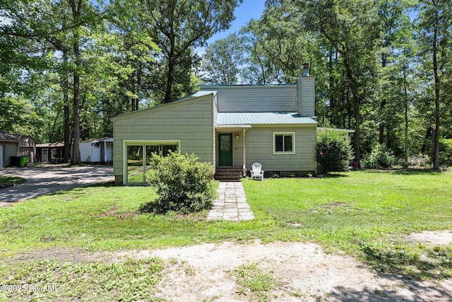 120 Croatan Ln, New Bern, NC 28562 - view of front of property with a chimney and a front lawn