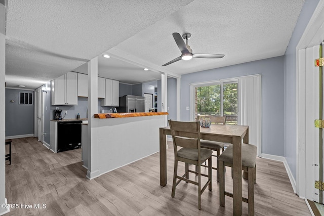 120 Croatan Ln, New Bern, NC 28562 - dining room with a textured ceiling, light wood finished floors, a ceiling fan, and recessed lighting