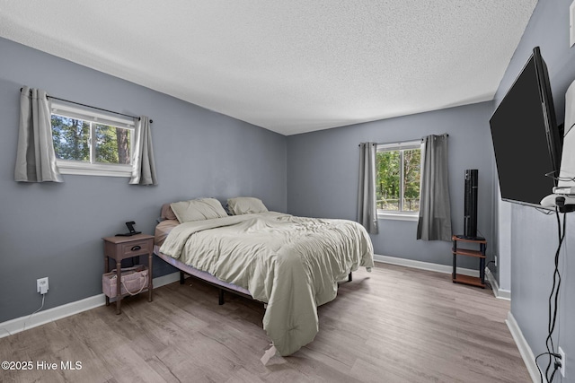 120 Croatan Ln, New Bern, NC 28562 - bedroom with a textured ceiling and wood finished floors