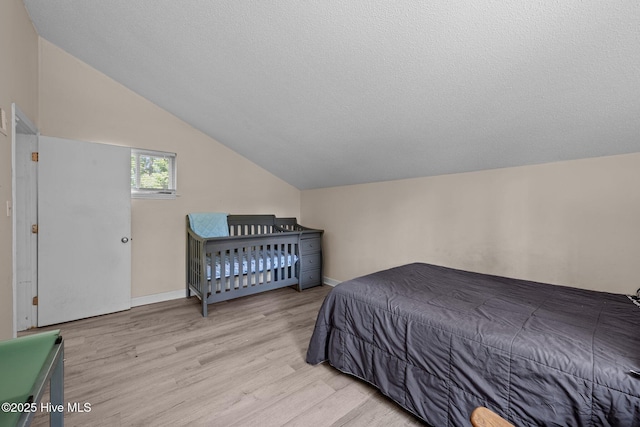 120 Croatan Ln, New Bern, NC 28562 - bedroom with light wood-style flooring and vaulted ceiling