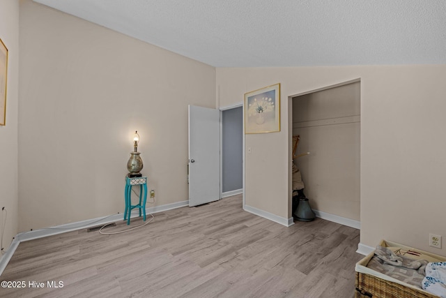 120 Croatan Ln, New Bern, NC 28562 - unfurnished bedroom featuring vaulted ceiling, wood finished floors, and a closet