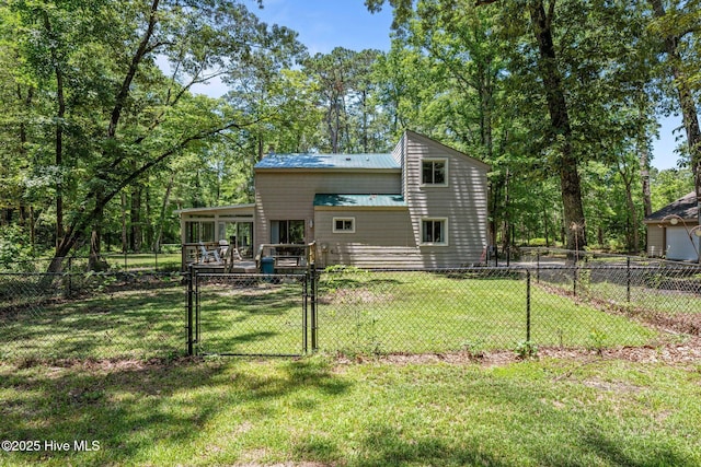120 Croatan Ln, New Bern, NC 28562 - back of house featuring a gate, a fenced backyard, a metal roof, and a sunroom