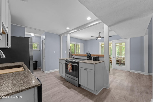 120 Croatan Ln, New Bern, NC 28562 - kitchen with appliances with stainless steel finishes, light wood-style floors, a ceiling fan, recessed lighting, and a textured ceiling