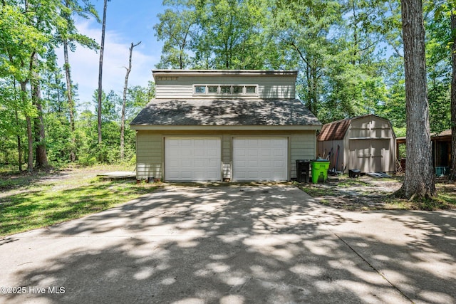 120 Croatan Ln, New Bern, NC 28562 - view of front of home featuring a storage unit, a shingled roof, and asphalt driveway