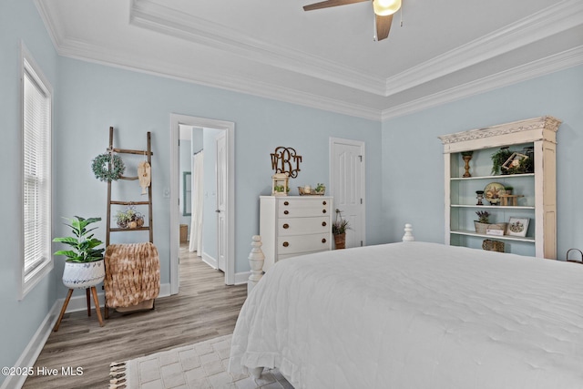505 Davidson Dr, Newport, NC 28570 - bedroom featuring crown molding, wood finished floors, a raised ceiling, and a ceiling fan