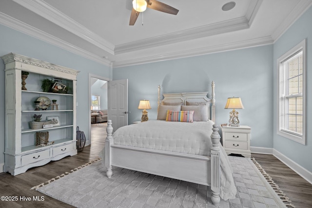 505 Davidson Dr, Newport, NC 28570 - bedroom featuring wood finished floors, a tray ceiling, crown molding, and ceiling fan