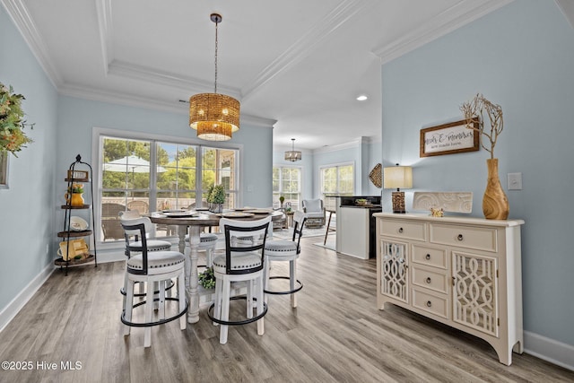 505 Davidson Dr, Newport, NC 28570 - dining space featuring plenty of natural light, light wood finished floors, recessed lighting, ornamental molding, and a chandelier