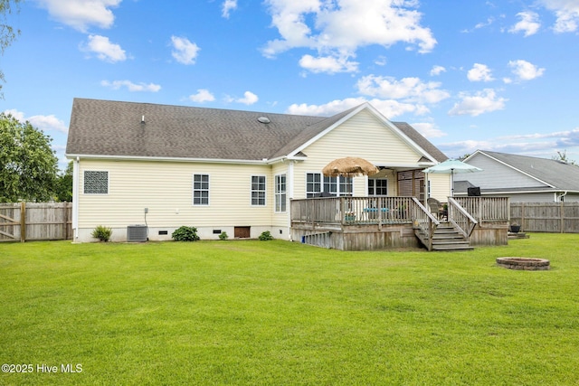 505 Davidson Dr, Newport, NC 28570 - back of property with a fire pit, a fenced backyard, crawl space, and a wooden deck